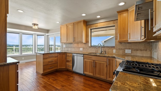 2003 W Canal Dr, Kennewick, WA 99336 - kitchen with dishwasher, a peninsula, healthy amount of natural light, tasteful backsplash, and recessed lighting