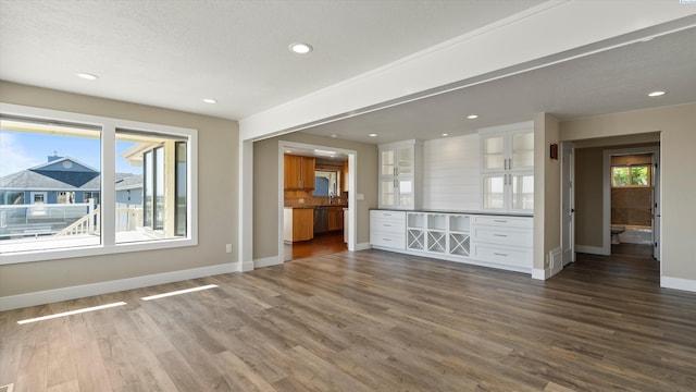 2003 W Canal Dr, Kennewick, WA 99336 - unfurnished living room featuring dark wood-style floors and recessed lighting