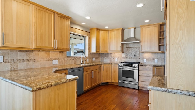 2003 W Canal Dr, Kennewick, WA 99336 - kitchen featuring wall chimney exhaust hood, appliances with stainless steel finishes, light brown cabinets, a peninsula, and dark wood-type flooring
