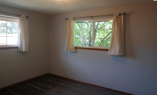1815 W 16th Ave, Kennewick, WA 99337 - unfurnished room with baseboards and dark colored carpet