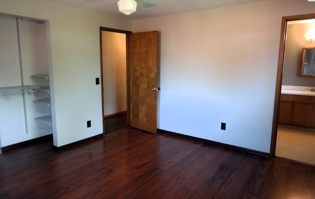 1815 W 16th Ave, Kennewick, WA 99337 - unfurnished bedroom featuring dark wood finished floors, baseboards, and a closet