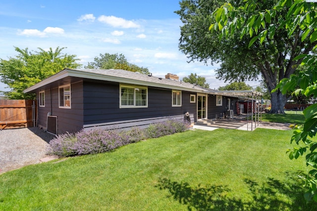 1815 W 16th Ave, Kennewick, WA 99337 - back of property featuring a chimney and a patio area