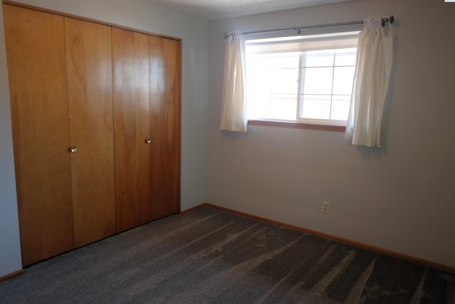 1815 W 16th Ave, Kennewick, WA 99337 - unfurnished bedroom featuring a closet, carpet, and baseboards