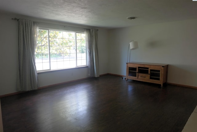 1815 W 16th Ave, Kennewick, WA 99337 - spare room with wood finished floors, baseboards, and a textured ceiling