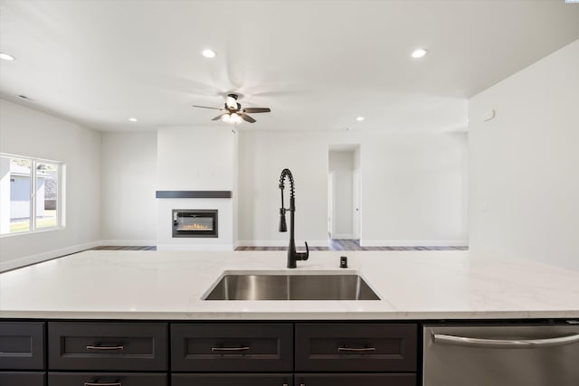 kitchen with a sink, open floor plan, dishwasher, ceiling fan, and recessed lighting