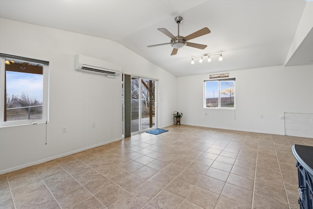 unfurnished room featuring vaulted ceiling, an AC wall unit, light tile patterned floors, and ceiling fan