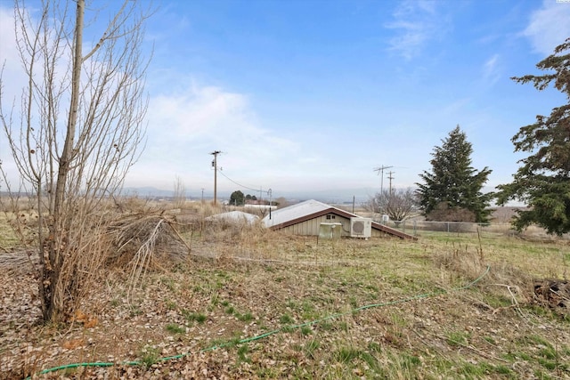 view of yard with a rural view