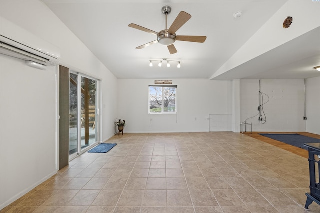 interior space featuring a wall mounted air conditioner, vaulted ceiling, ceiling fan, and light tile patterned flooring