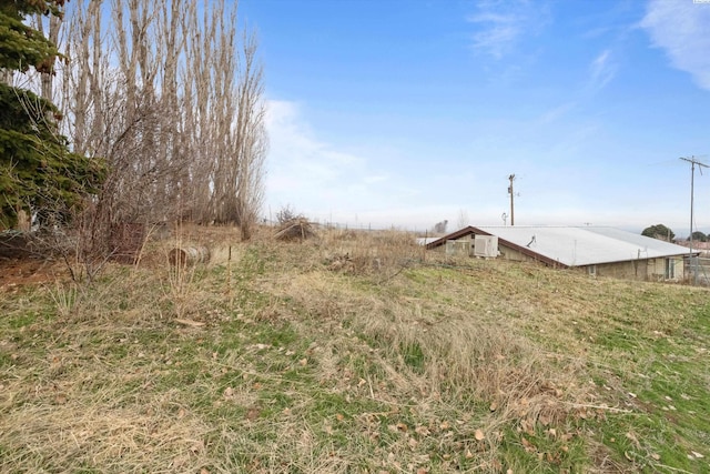 view of yard with a rural view