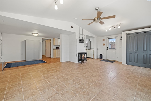 interior space with ceiling fan and lofted ceiling