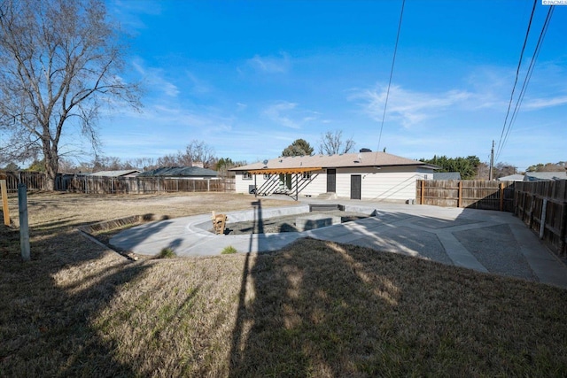 exterior space featuring a patio area, a yard, and a fenced backyard