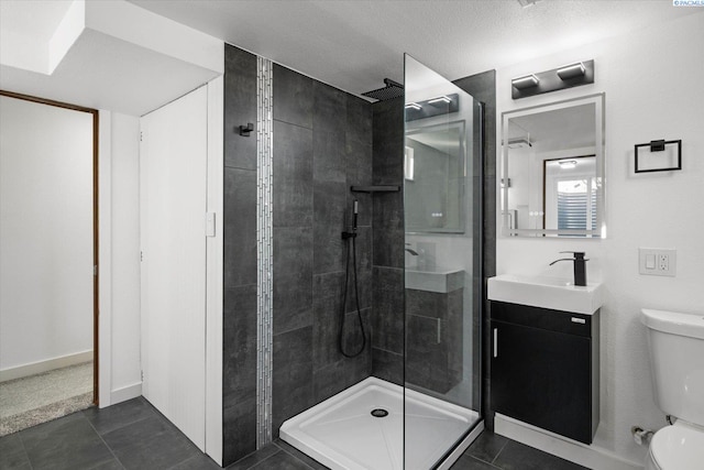 full bathroom with toilet, a stall shower, vanity, tile patterned flooring, and baseboards