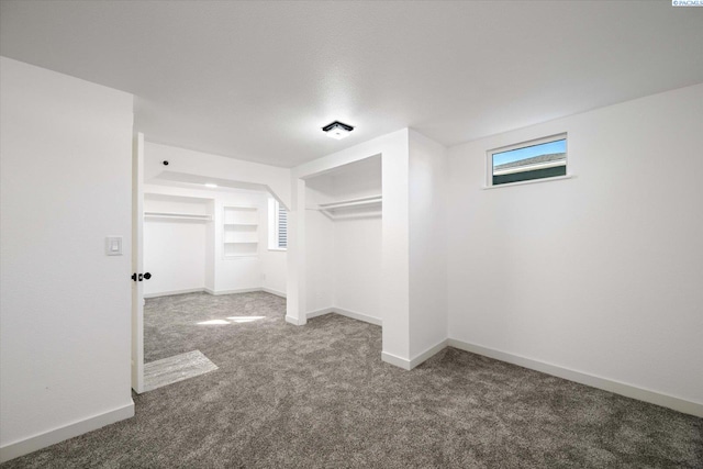 below grade area with carpet floors and baseboards