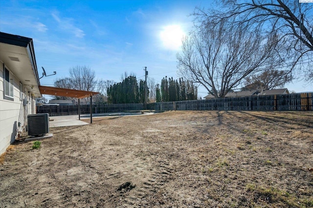 view of yard featuring a patio, a fenced backyard, and cooling unit