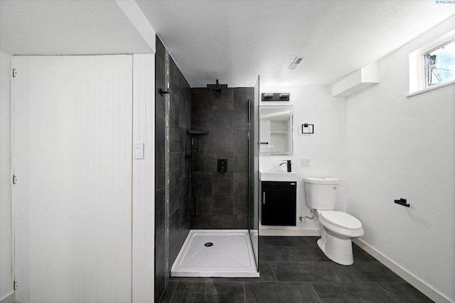 full bath featuring toilet, vanity, baseboards, tile patterned floors, and a stall shower