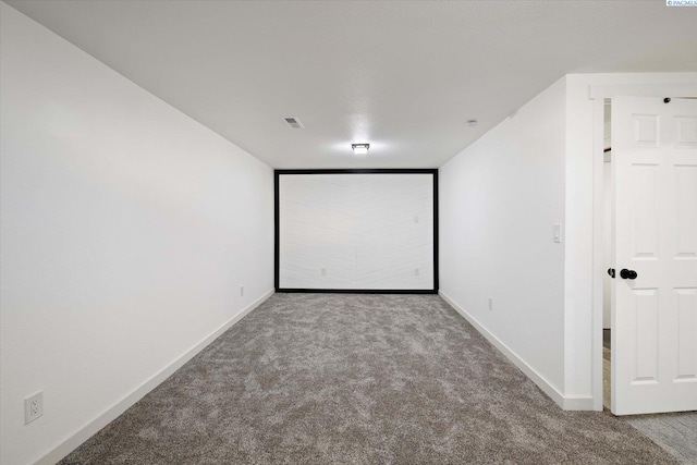 carpeted cinema with baseboards