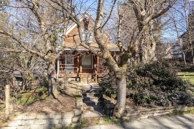 obstructed view of property featuring a porch