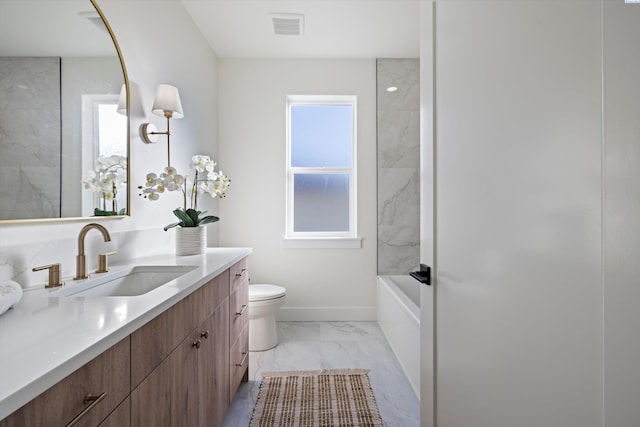 bathroom with toilet, visible vents, vanity, baseboards, and marble finish floor