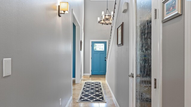 2876 Crosswater Loop, Richland, WA 99354 - doorway to outside with a chandelier and baseboards