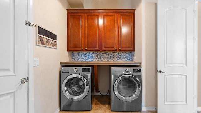 2876 Crosswater Loop, Richland, WA 99354 - washroom with washer and clothes dryer, cabinet space, and baseboards