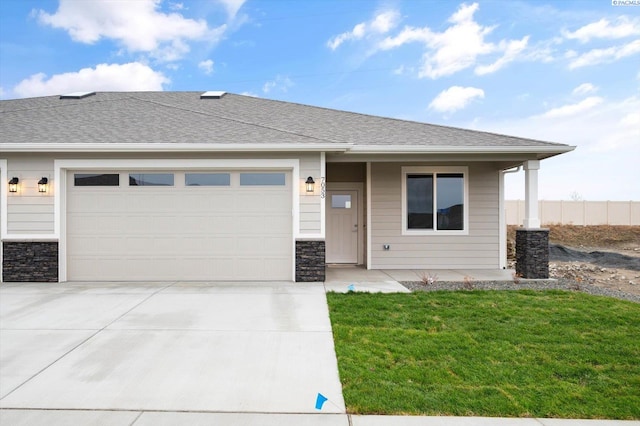 view of front of home with a porch, a garage, and a front lawn