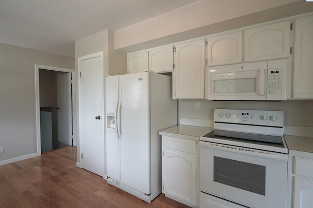 610 Dilke St, Pullman, WA 99163 - kitchen with white appliances, light wood finished floors, white cabinetry, and light countertops