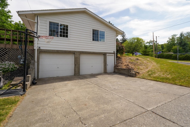 610 Dilke St, Pullman, WA 99163 - view of property exterior with an attached garage, driveway, and a lawn