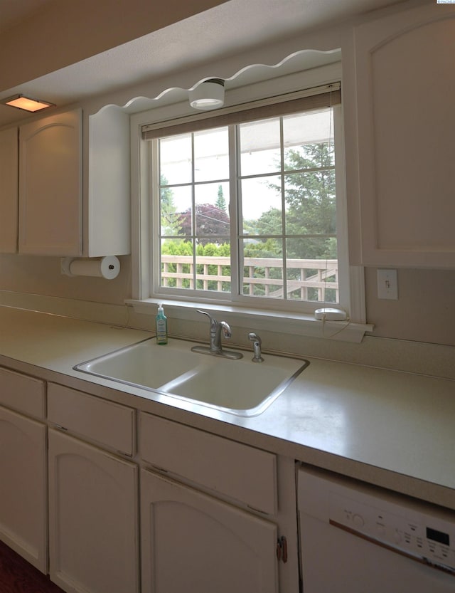 610 Dilke St, Pullman, WA 99163 - kitchen featuring dishwasher, white cabinetry, and light countertops
