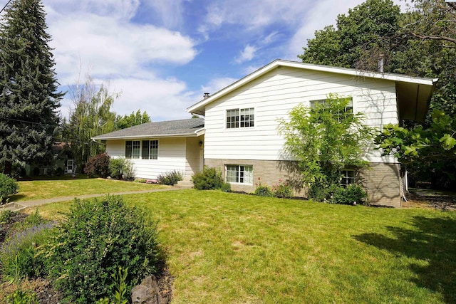 610 Dilke St, Pullman, WA 99163 - view of front of home with a front yard and brick siding