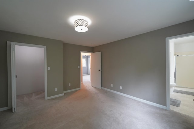 610 Dilke St, Pullman, WA 99163 - unfurnished bedroom featuring light colored carpet and ensuite bath