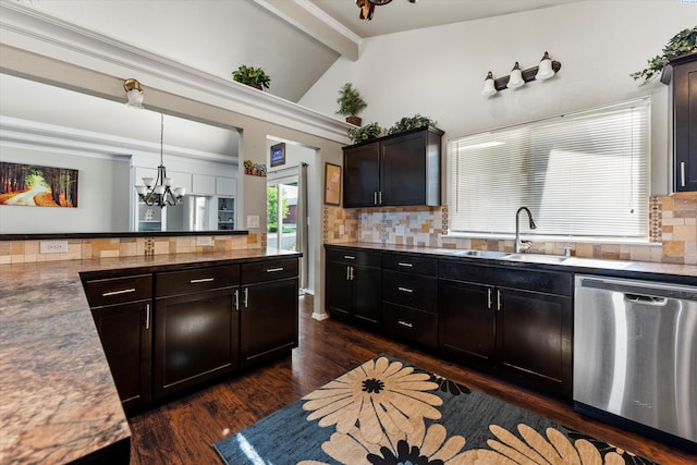 640 N Almira Ave, Connell, WA 99326 - kitchen with dishwasher, a chandelier, backsplash, dark wood-style floors, and decorative light fixtures