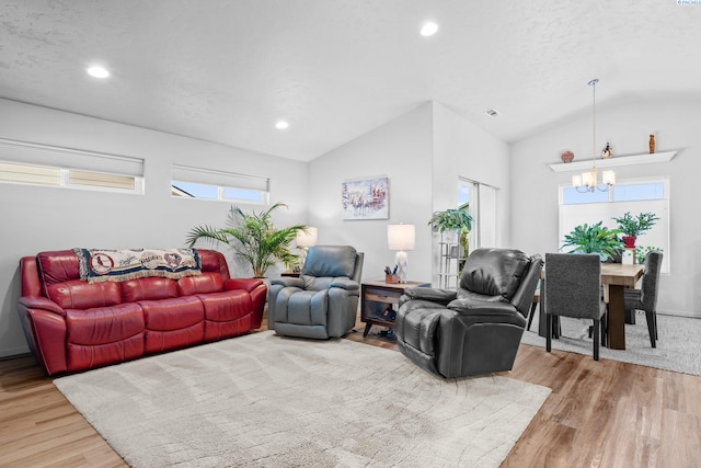 6217 Sidon Ln, Pasco, WA 99301 - living room with a chandelier, vaulted ceiling, light wood-type flooring, and recessed lighting
