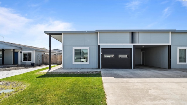 520 Whitefish Ln, Pasco, WA 99301 - view of front of house featuring driveway, a carport, and a garage