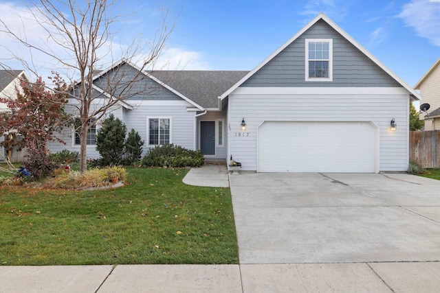 view of front facade featuring a garage and a front lawn