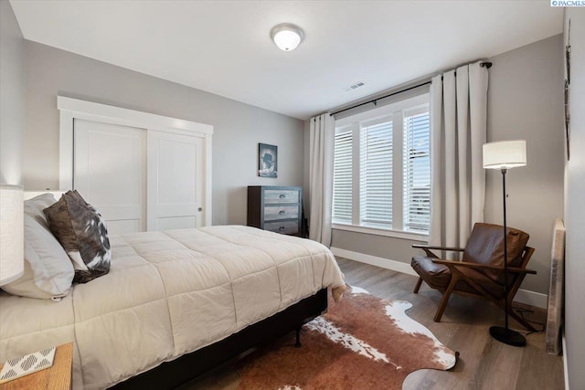 bedroom with wood-type flooring