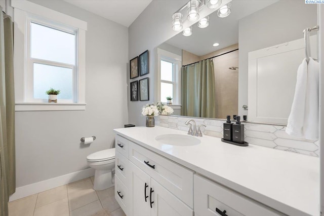 bathroom featuring vanity, tile patterned flooring, curtained shower, and toilet