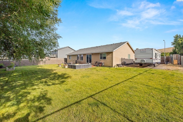 1716 W 40th Ave, Kennewick, WA 99337 - rear view of house with a fenced backyard