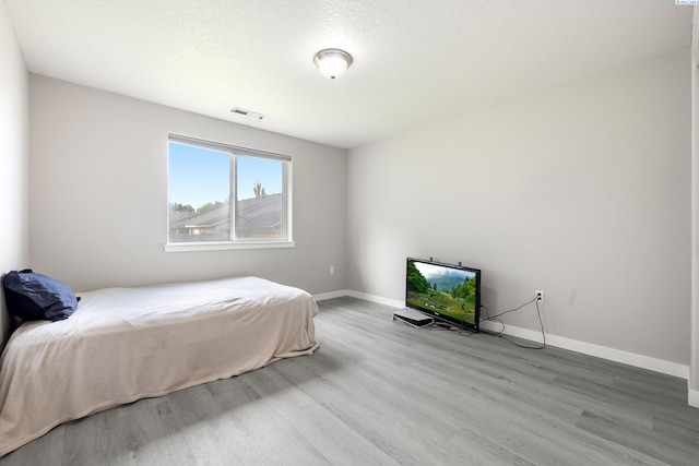 1716 W 40th Ave, Kennewick, WA 99337 - bedroom with wood finished floors and baseboards