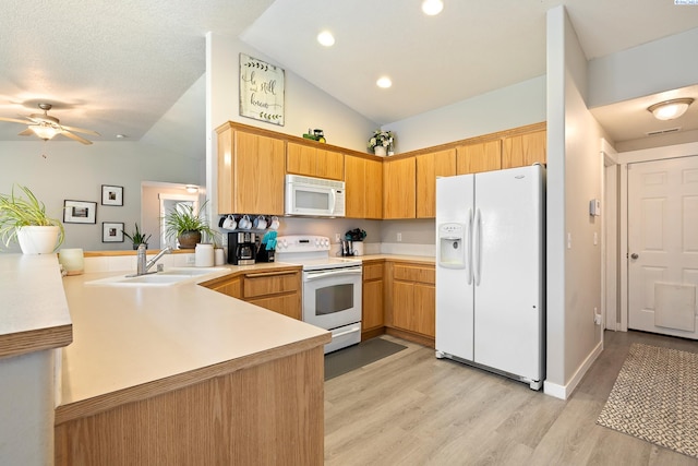 1716 W 40th Ave, Kennewick, WA 99337 - kitchen with white appliances, lofted ceiling, light countertops, a ceiling fan, and a peninsula
