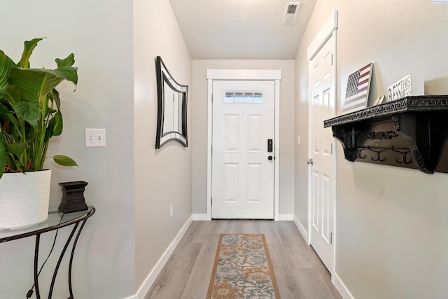 1716 W 40th Ave, Kennewick, WA 99337 - entryway with light wood-style floors and a textured ceiling