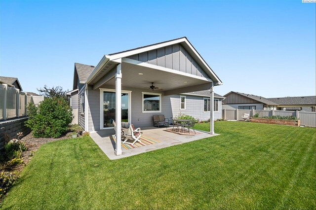 3763 S Sherman St, Kennewick, WA 99338 - rear view of house with ceiling fan, a fenced backyard, board and batten siding, and a patio area