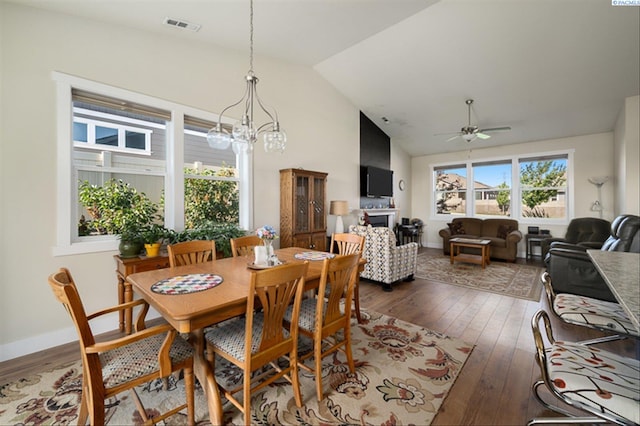 3763 S Sherman St, Kennewick, WA 99338 - dining room with hardwood / wood-style floors, a ceiling fan, a chandelier, and high vaulted ceiling
