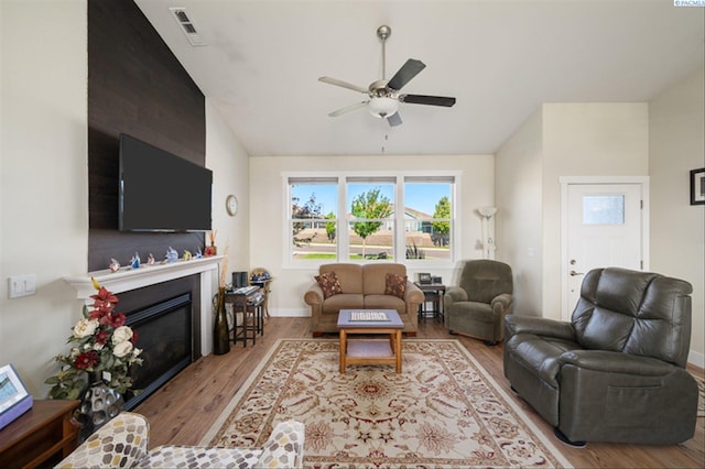 3763 S Sherman St, Kennewick, WA 99338 - living area with wood finished floors, ceiling fan, vaulted ceiling, and a glass covered fireplace