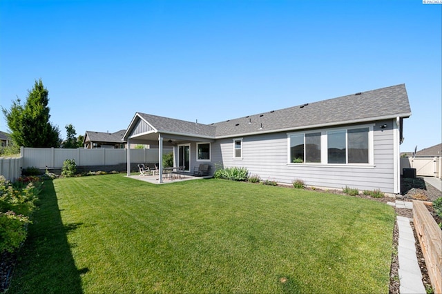 3763 S Sherman St, Kennewick, WA 99338 - back of property with a patio area, a fenced backyard, a ceiling fan, and roof with shingles