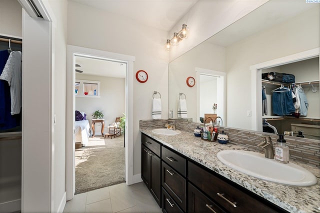 3763 S Sherman St, Kennewick, WA 99338 - bathroom featuring double vanity, tile patterned flooring, a spacious closet, and ensuite bathroom