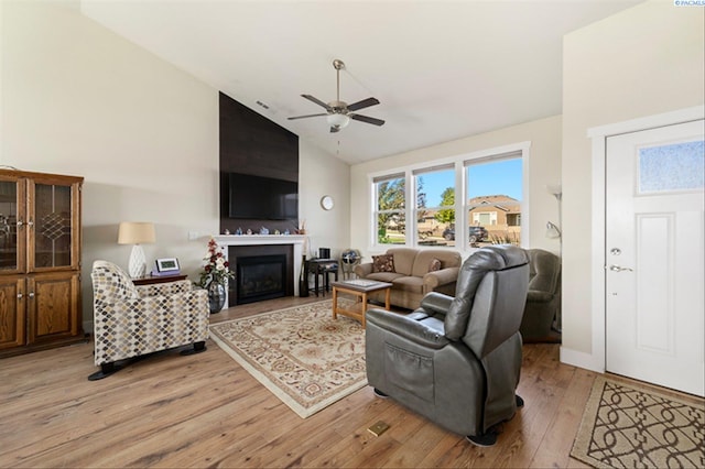 3763 S Sherman St, Kennewick, WA 99338 - living room featuring light wood-type flooring, a ceiling fan, high vaulted ceiling, and a fireplace
