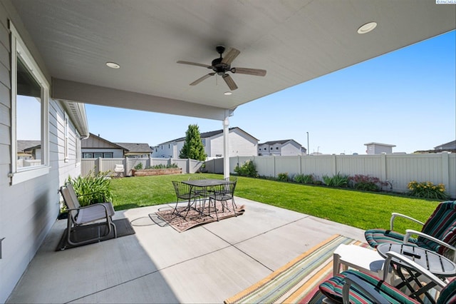 3763 S Sherman St, Kennewick, WA 99338 - fenced backyard featuring outdoor dining space, a patio, a ceiling fan, and a residential view