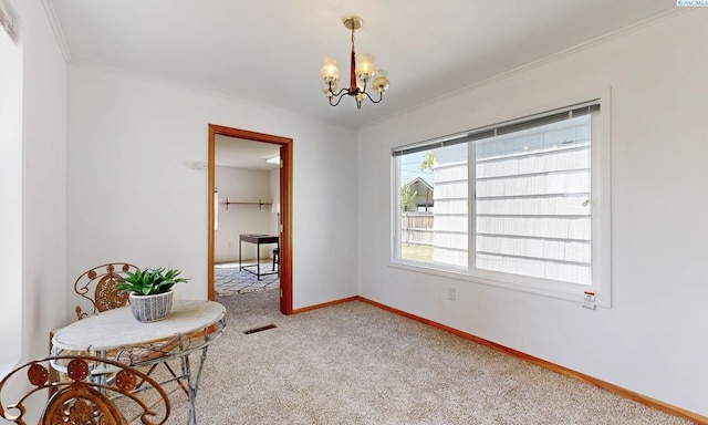 912 S Alder St, Kennewick, WA 99336 - carpeted empty room with a chandelier and ornamental molding
