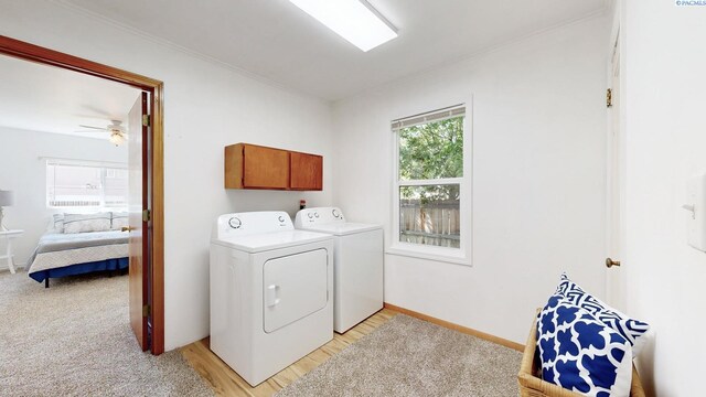 912 S Alder St, Kennewick, WA 99336 - washroom featuring washing machine and clothes dryer, cabinet space, ornamental molding, light wood-style floors, and ceiling fan