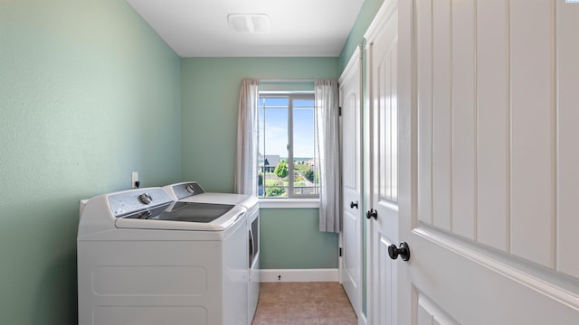 76704 E Timothy Ln, Kennewick, WA 99338 - laundry area with washer and clothes dryer, baseboards, and light tile patterned floors